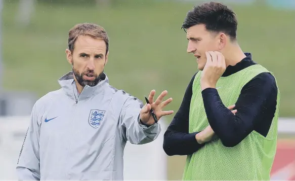  ??  ?? England manager Gareth Southgate and Harry Maguire.