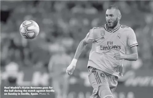  ?? Photo: IC ?? Real Madrid’s Karim Benzema goes for the ball during the match against Sevilla on Sunday in Seville, Spain.