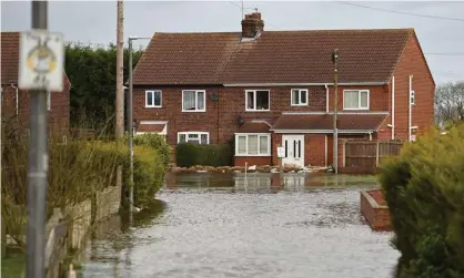  ??  ?? Flooding in East Cowick in March 2020. Unfortunat­ely as Britain becomes warmer it will also become wetter because of warming air trapping moisture in the atmosphere. Photograph: Oli Scarff/AFP via Getty Images