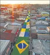  ?? ?? A view of a street decorated to mark the Qatar World Cup, in the Alvorada neighbourh­ood of Manaus, Amazonas state in Brazil.