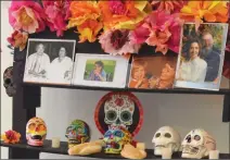  ??  ?? SEEN HERE IS A PORTION of a Day of the Dead altar created by PSA Art Awakenings. It is one of six altars on display through Saturday at the Yuma Main Library.