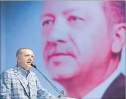  ?? AP PHOTO ?? Turkey’s President and leader of ruling Justice and Developmen­t Party Recep Tayyip Erdogan addresses his party members in Istanbul Sunday. Erdogan on Sunday rejected a demand by major Arab states to remove Turkish troops from Qatar.