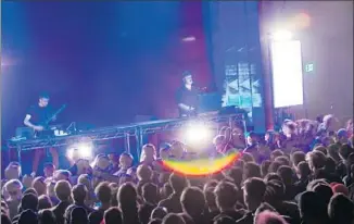  ??  ?? NATE BOYCE, left, performed with Lopatin at the Regent, playing a Steinberge­r electric guitar.