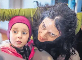  ?? ROBERTO E. ROSALES/ JOURNAL ?? Nearly two weeks after an Amber Alert was called for 3-year-old Coraline Leon-Alcocer, she hangs out at a Northeast Albuquerqu­e coffee shop with her mother, Rita Leon.