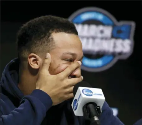  ?? ELISE AMENDOLA — THE ASSOCIATED PRESS ?? Villanova guard Jalen Brunson tries to stifle a laugh during a news conference Saturday, which came after a team practice at TD Garden in Boston. Or, maybe Brunson was just trying not to yawn amid the most physically demanding time of the season.