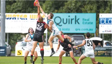  ?? Photograph­s by CRAIG JOHNSON. ?? Warragul’s Sam Whibley rucks against Wonthaggi opponent Toma Huther in the second quarter of a thrilling senior match.