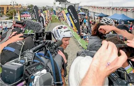  ?? PHOTO: GETTY IMAGES ?? Sam Clark speaks to the media after winning the one-day individual competitio­n of the Coast to Coast race.