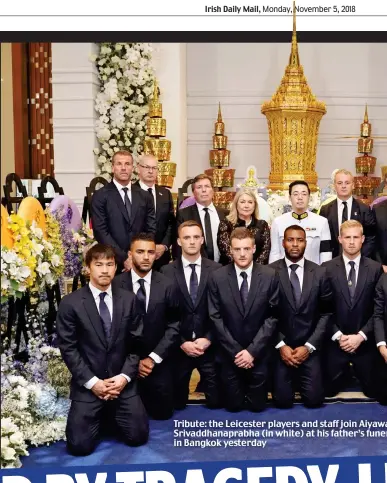  ??  ?? Tribute: the Leicester players and staff join Aiyawa Srivaddhan­aprabha (in white) at his father’s funer in Bangkok yesterday