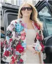  ??  ?? Melania Trump and her $51,000, colourful floral applique jacket by Dolce & Gabbana.