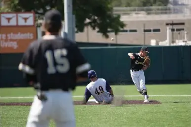  ?? Staff photo by Evan Lewis ?? Pleasant Grove freshman shortstop Jackson Cobb fires off a throw to first base after making the out on Abilene Wylie's Bryce Gist in the third inning of a 4A semifinal game Wednesday at UFCU Disch-Falk Field in Austin. The Hawks lost to the Bulldogs, 3-1.