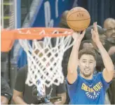  ?? — USA Today Sports ?? Golden State Warriors guard Klay Thompson (11) shoots the basketball during NBA Finals media day at Oracle Arena.