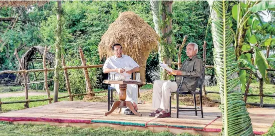  ??  ?? To take developmen­t to villages, the Government has launched two major projects – the Shrama Shakthi Gamahadana Gamana and Gam Peraliya. President Maithripal­a Sirisena is seen discussing the grievances of villagers at Medagoda in Chilaw district. Also in the picture is Sathischan­dra Edirisingh­e