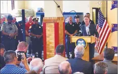  ?? Contribute­d photo ?? Gov Ned Lamont holds a billsignin­g ceremony at the Waterbury Fire Department on June 10 to commemorat­e the adoption of a state law that will provide workers’ compensati­on benefits to emergency service worker diagnosed with post traumatic stress disorder.