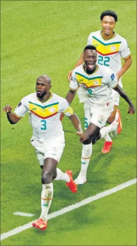  ?? REUTERS ?? Senegal's Kalidou Koulibaly (front) celebrates after scoring the winner against Ecuador in their final Group A match at the Khalifa Internatio­nal Stadium on Tuesday.