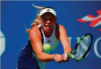  ?? AFP ?? Caroline Wozniacki of Denmark hits a return to Taylor Townsend of United States during their US Open 2016 Women’s Singles Round 1 match at the USTA Billie Jean King National Tennis Centre in New York yesterday.