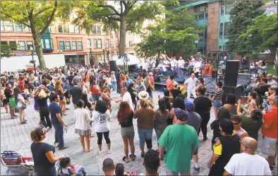  ?? Christian Abraham / Hearst Connecticu­t Media file photo ?? The Latin band Orquestra Afinke performed as part of Legendary Latin Night during the Downtown Thursdays Concert Series at McLevy Green in downtown Bridgeport in July 2018.