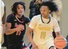  ?? KARL MERTON FERRON/BALTIMORE SUN ?? Archbishop Spalding wing Malik Washington, left, defends St. Frances guard Carlton Carrington Jr., who dribbles behind guard Jahnathan Lamothe (5), during the 52nd Baltimore Catholic League Tournament quarterfin­als at Goucher College on Friday.