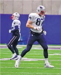  ?? MARK HUMPHREY/ASSOCIATED PRESS ?? Patriots tight end Rob Gronkowski, shown warming up before Wednesday’s drills in Minneapoli­s, has finally been cleared of concussion protocol after suffering his injury in the AFC title game.