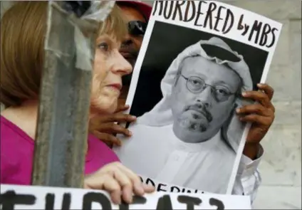  ?? ASSOCIATED PRESS ?? People hold signs during recent protest at the Embassy of Saudi Arabia in Washington, D.C., about the disappeara­nce of Saudi journalist Jamal Khashoggi, in Washington.