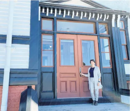  ?? JOHN DeMONT • SALTWIRE NETWORK ?? Rachel Bailey, president of the Lunenburg Academy Foundation, stands in front of the iconic Lunenburg Academy, which the municipali­ty wants to divest.