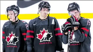  ?? — PHOTOS: CP ?? From left: Ty Smith, Evan Bouchard and Shane Bowers look despondent after Canada lost a 2-1 heart-breaker to Finland at the world juniors on Wednesday. While Bouchard picked up three assists over the tourney, Canada’s defence just was not mobile enough, one big reason why it did not advance. Below: Canada seemed to get worse deeper into the tournament, a failing that must be laid at the feet of head coach Tim Hunter.