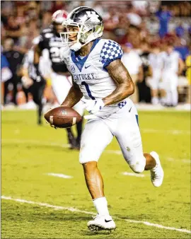  ?? CARMEN MANDATO / GETTY IMAGES ?? Kentucky moved receiver Lynn Bowden to quarterbac­k last week, and he rushed for 196 yards and two touchdowns and passed for 71 yards and another score in a 24-20 victory over Arkansas.