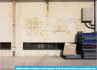  ??  ?? KUWAIT: Graffiti at a building in Kuwait showing a tic-tac-toe puzzle solved in an unconventi­onal way, with the word ‘Wasta’ (connection­s) given as an explanatio­n. —Photo by Athoob Al-Shuaibi