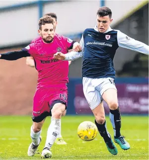  ?? Picture: SNS. ?? Tony Andreu, left, with Ross Matthews, who was struck by the coin, tussle for possession on Saturday.