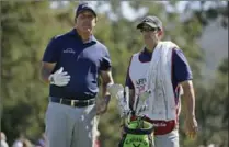  ?? ASSOCIATED PRESS FILE PHOTO ?? Phil Mickelson, left, reads the wind while standing with his caddie, his brother Tim Mickelson, at the Safeway Open in October.