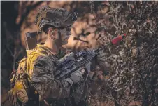  ?? ?? A 3RAR soldier on patrol.