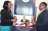  ?? PHOTOS BY CHRISTOPHE­R SERJU ?? Althea West-Myers, manager of the business advisory services department at the Jamaica Business Developmen­t Corporatio­n (JDBC), is happy to tell Wayne Beecher, chief executive officer of Innovision­s, about the range of services available from and...