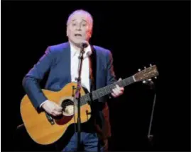  ?? JULIE JACOBSON — THE ASSOCIATED PRESS FILE ?? Musician Paul Simon performs during the Global Citizen Festival, in New York. Simon wrapped up his farewell concert tour Saturday at a park in Queens, a bicycle ride across the borough from where he grew up. The 76-year-old singer picked Flushing Meadows Corona Park to say goodbye, an outdoor show on the first night of autumn.