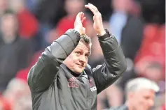  ??  ?? Manchester United’s Norwegian caretaker manager Ole Gunnar Solskjaer applauds supporters on the pitch after the English Premier League football match between Manchester United and Southampto­n at Old Trafford in Manchester, north west England, on March 2, 2019. - Manchester United won the game 3-2. - AFP photo