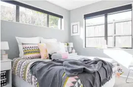  ?? Photo / Bryce Carleton ?? Grey is a versatile colour that can be teamed with most other colours, giving you the freedom to change the way the room feels simply by changing the duvet and linen. This bedroom is Resene Delta, softened with the use of pink accessorie­s.