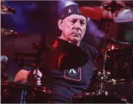  ?? RICH FURY — INVISION VIA AP ?? Neil Peart of Rush performs during the final show of the R40Tour in Los Angeles in 2015. Peart retired after the tour. He died Tuesday after battling brain cancer.