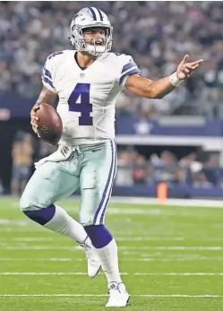  ?? MATTHEW EMMONS, USA TODAY SPORTS ?? With the overtime win Sunday against the Eagles, the Cowboys’ Dak Prescott became the second rookie quarterbac­k in NFL history to lead his team to a 6- 1 start.