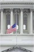 ?? PATRICK SEMANSKY/AP ?? An American flag flies at half-staff in remembranc­e of U.S. Capitol Police Officer Brian Sicknick in Washington, D.C., on Friday.