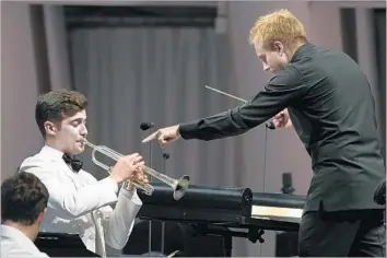  ?? Wally Skalij Los Angeles Times ?? HUNGARIAN trumpeter Tamás Pálfalvi and Russian conductor Vasily Petrenko at Thursday’s Bowl concert.