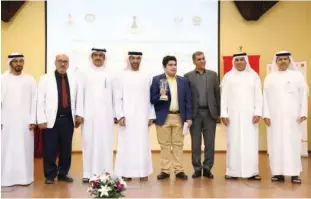  ??  ?? Parham Maghsoodlo­o poses with the trophy along with officials after winning the Sharjah Masters Chess Championsh­ip.