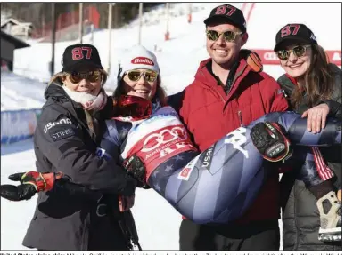  ?? (AP/Alessandro Trovati) ?? United States alpine skier Mikaela Shiffrin (center) is picked up by her brother Taylor (second from right) after the Women’s World Cup slalom competitio­n on Saturday in Are, Sweden. Shiffrin has won a record 87 World Cup races.