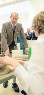  ?? Pictures: Kim Cessford. ?? Left: The Earl views the statue he unveiled during his visit yesterday. Above: Prince Edward took the time to chat to Montrose Academy pupils.