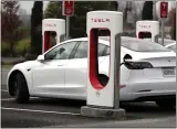  ?? JUSTIN SULLIVAN — GETTY IMAGES ?? Investors showed their enthusiasm for Tesla’s delivery report Friday, sending the company’s stock price to a record-high close of $443.01.