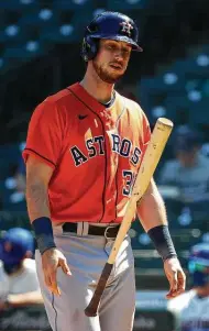  ??  ?? Kyle Tucker flips his bat after striking out against the Mariners. The Astros went 1 for 29 at the plate.