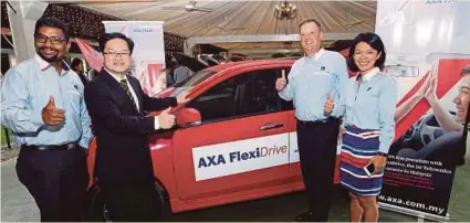  ?? PIC BY ASWADI ALIAS ?? (From left) AXA Affin General Insurance (AAGI) chief transforma­tion and operations officer Rohit C. Nambiar, Malaysian Institute of Road Safety Research director-general professor Dr Wong Shaw Voon, AAGI chief executive officer Emmanuel Nivet and chief...