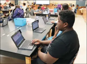  ?? CHELSEA VONGHER/LODI UNIFIED SCHOOL DISTRICT ?? Students at Christa McAuliffe Middle School in Stockton use Chromebook­s that they are allowed to take home as part of Lodi Unified School District's 1:1 Home-to-School Connection program.
