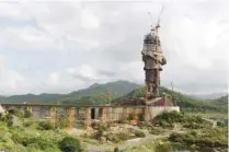  ??  ?? A statue dedicated to independen­ce leader Sardar Vallabhbha­i Patel is pictured during its constructi­on, overlookin­g the Sardar Sarovar Dam near Vadodara in Gujarat. — AFP