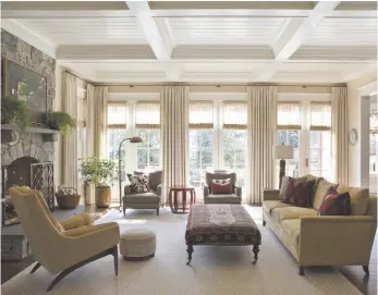  ?? CITIZEN NEWS SERVICE PHOTO ?? This photo provided by Marika Meyer Interiors shows a living room in McLean, Va. that demonstrat­es the 2019 trend toward warm neutral colours and antique furniture in warm wood tones.