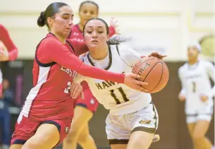  ?? DAVID GARRETT PHOTOS/SPECIAL TO THE MORNING CALL ?? Bethlehem Catholic’s Leah Ault (11) is defended by Easton’s Megan Elias during Friday’s EPC game at Bethlehem Catholic High School in Bethlehem.
