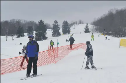  ?? PHOTOS BY SHEENA HOLLAND DOLAN — THE NEWS-HERALD ?? Families flocked to Alpine Valley on Jan. 31 after a light snowfall to enjoy some outdoor activities.