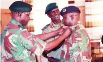  ?? ?? Lieutenant General Anselem Nhamo Sanyatwe confers new rank to Brigadier-General Richard Mahoya